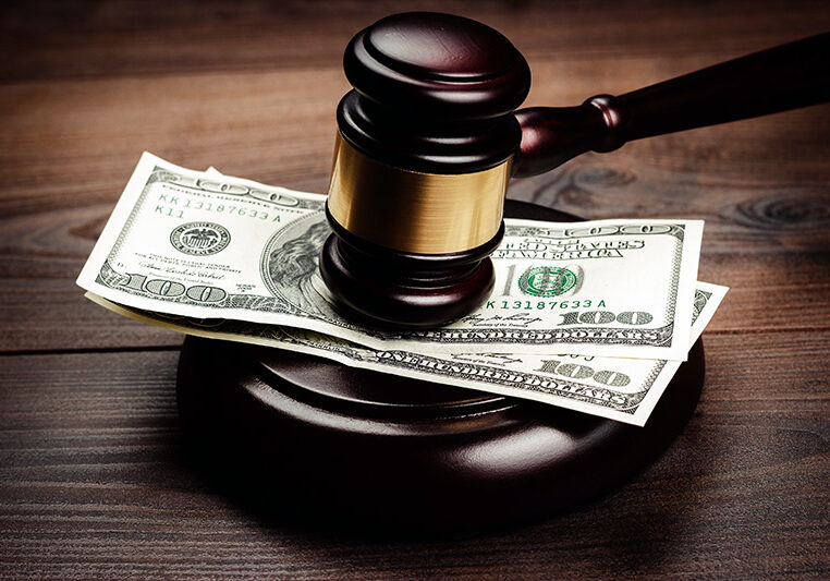 judge gavel and money on brown wooden table concept